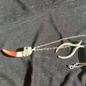 Tiger Tooth Amulet Necklace Pendant with another charm added after purchase.